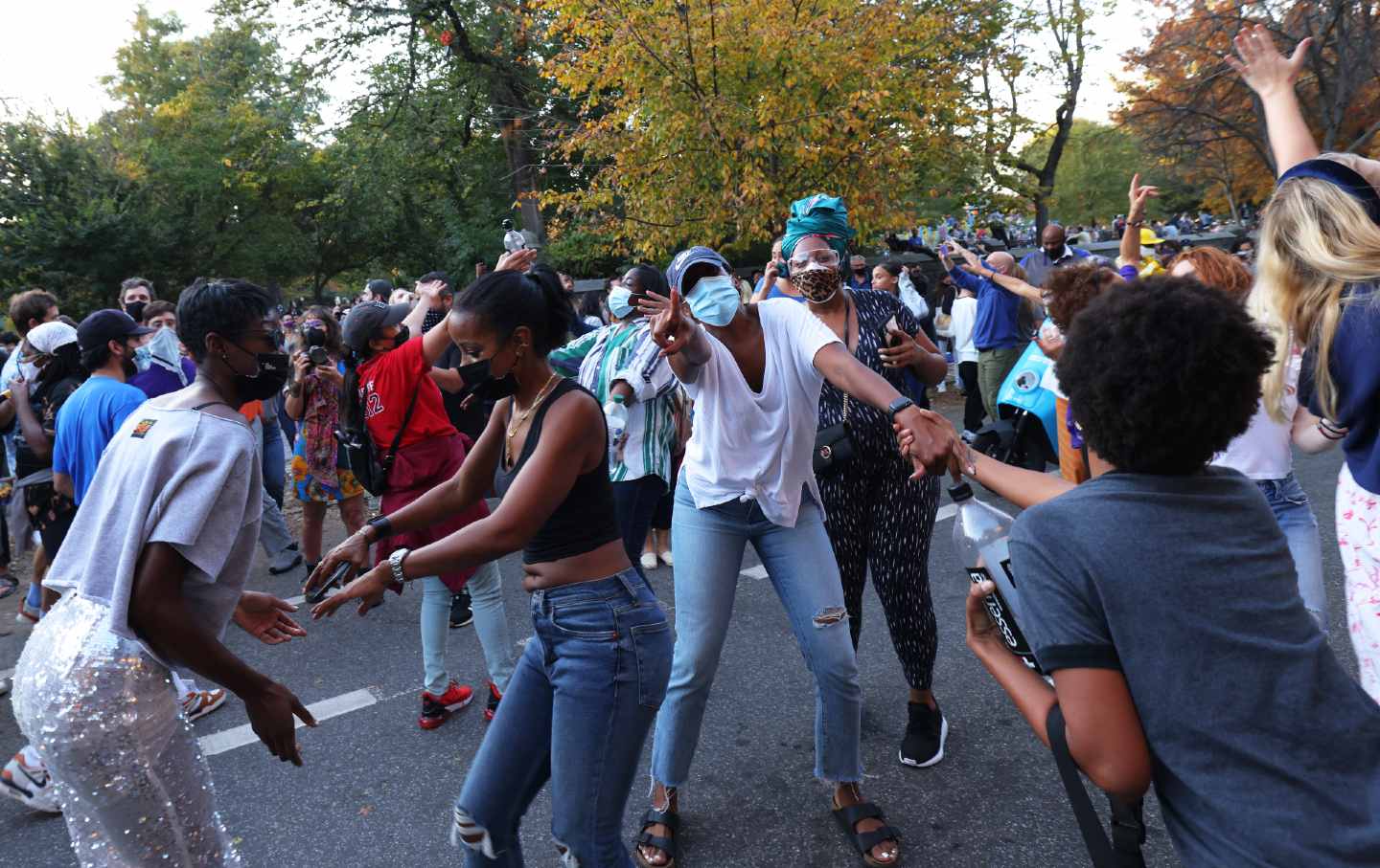 People dance in the street after Joe Biden wins the 2020 election.