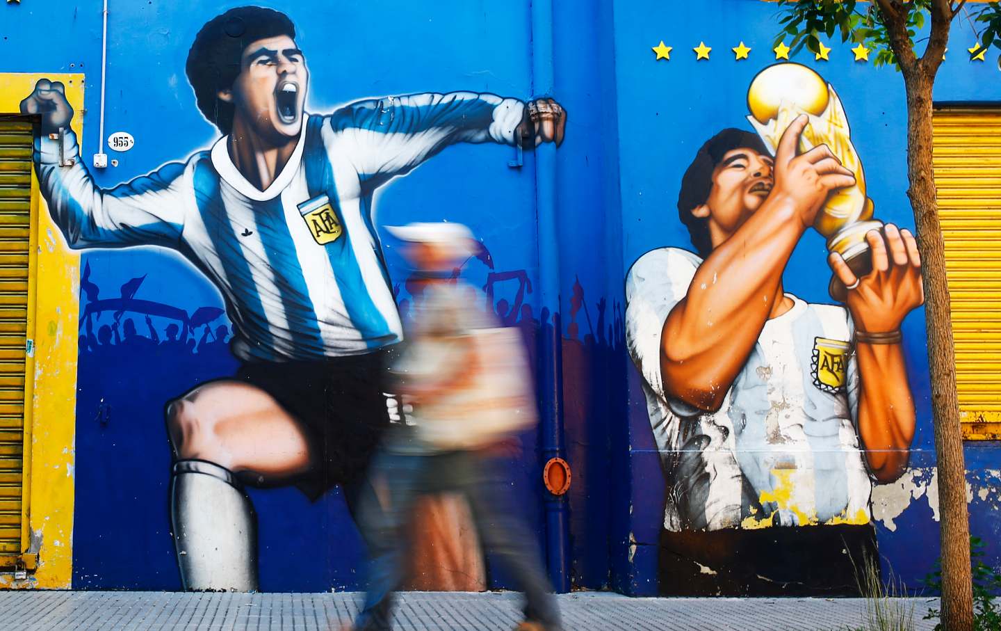 Former Argentina's soccer star Diego Maradona, left, shields the