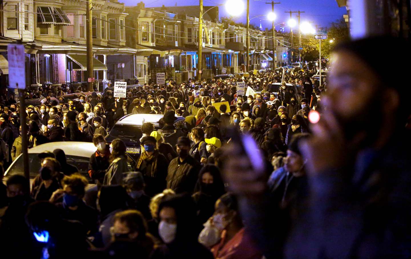 Protestors in Philidelphia march through the street