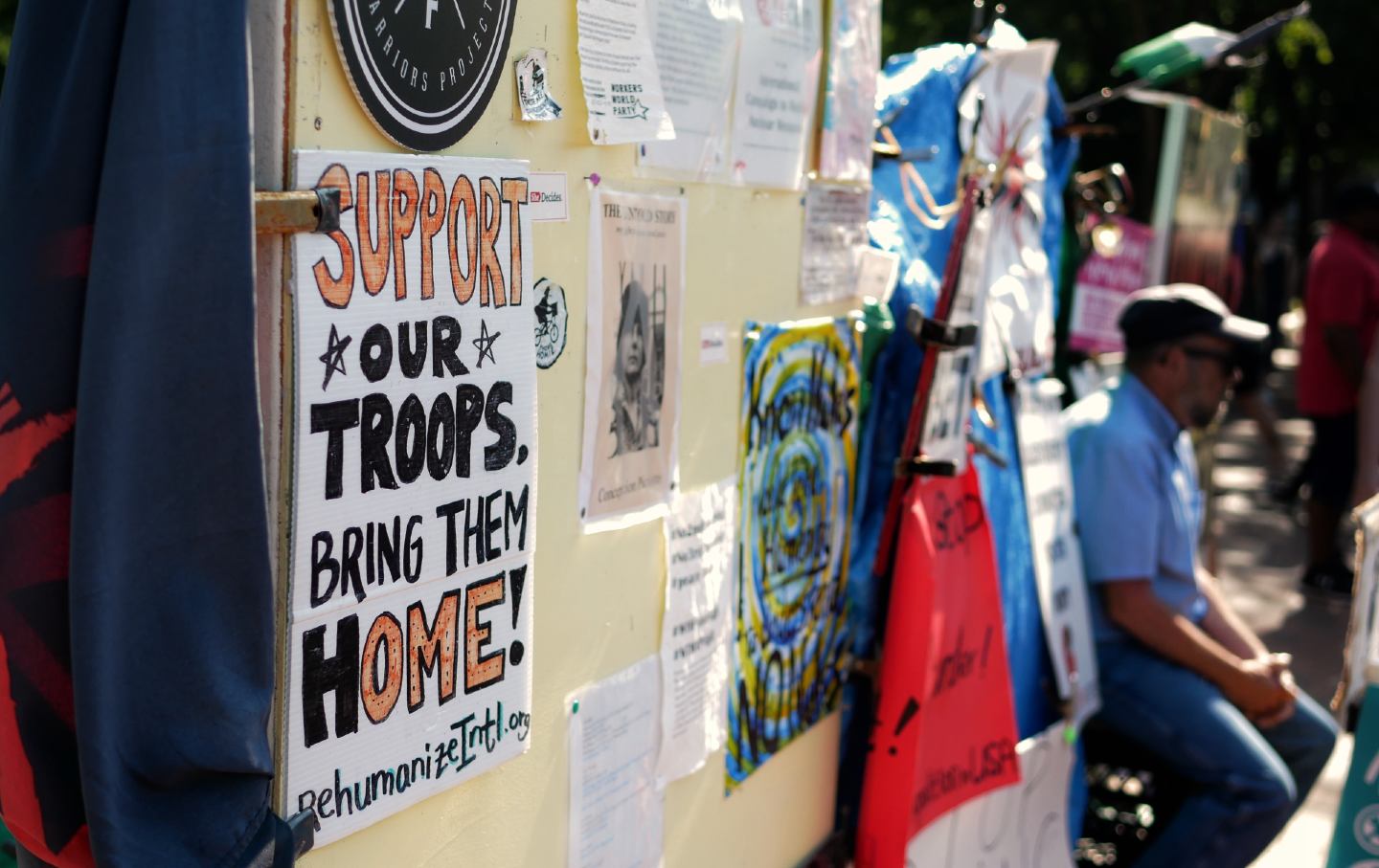 A sign supporting the return of military troops from wars abroad is displayed in front of the White House in 2018.