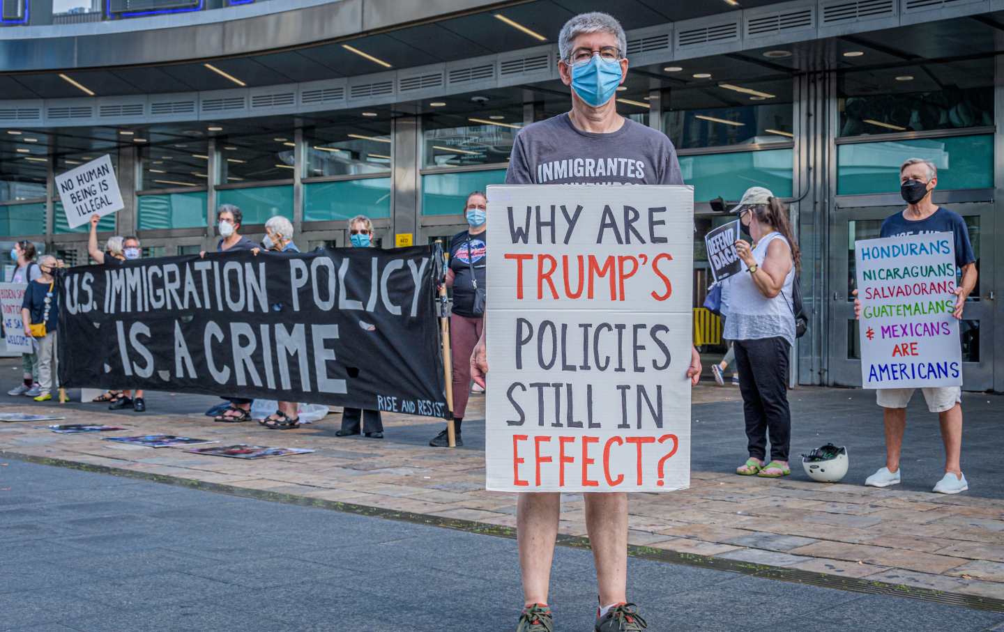 Protesters holds sign