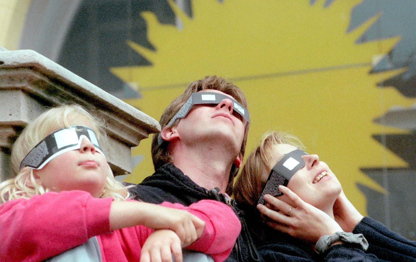 A family watches the solar eclipse in Germany, 1999.