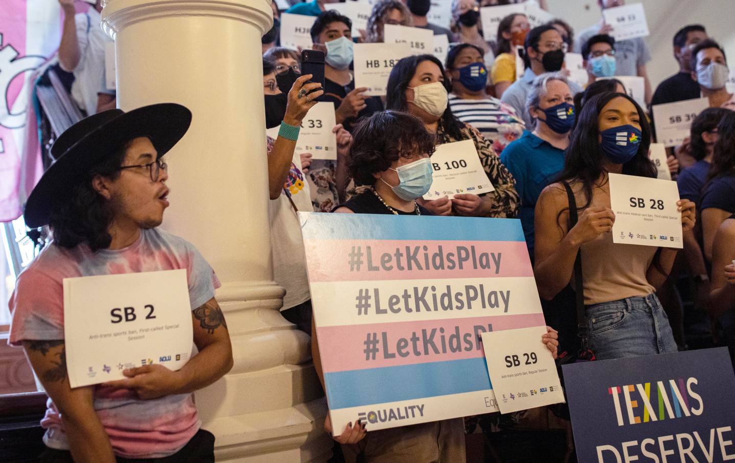 LGBTQ rights supporters holding signs.