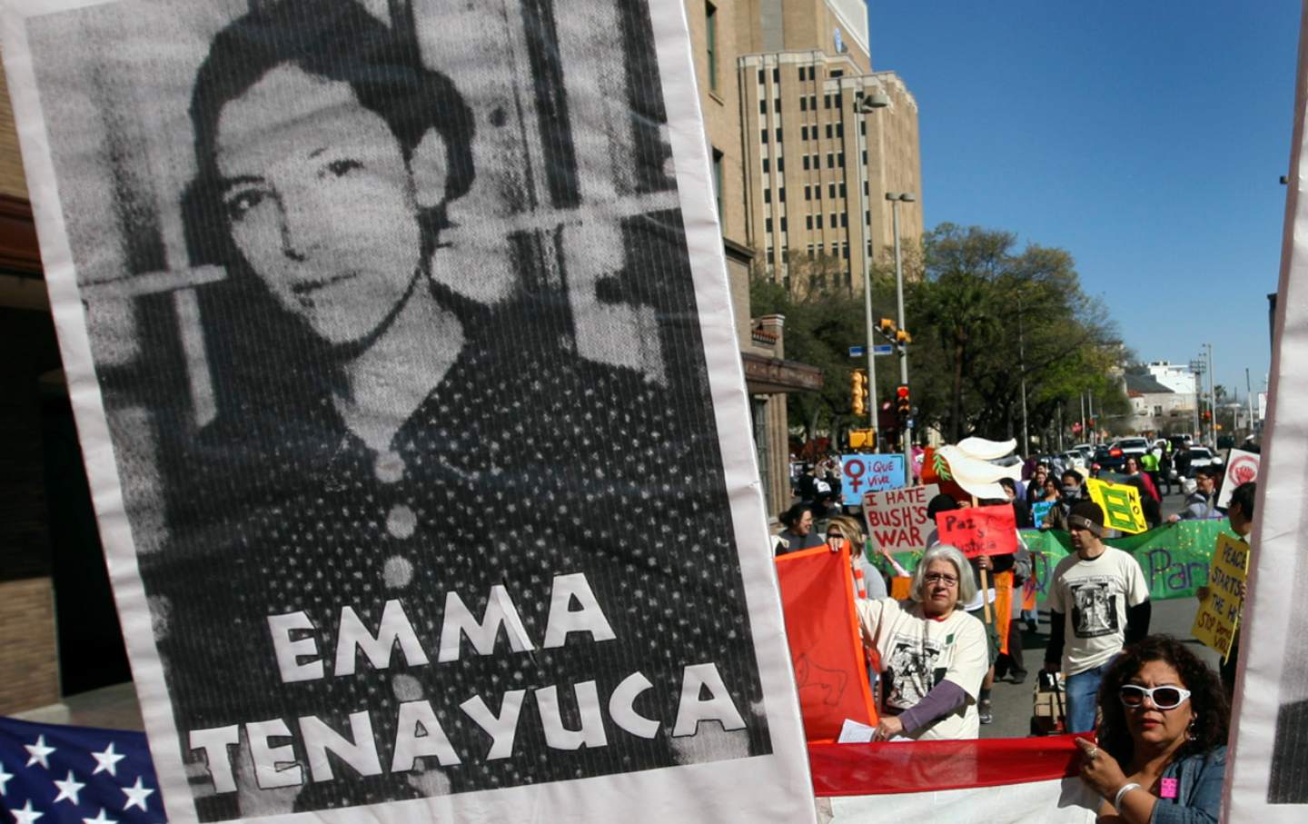 A sign featuring Emma Tenayuca takes front and center at a march for International Women's Day