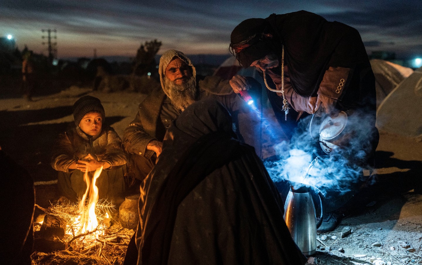 Afghan family prepares tea