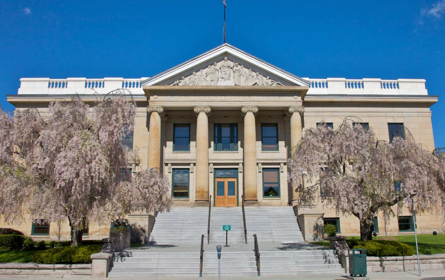 Trees bloom outside a courthouse
