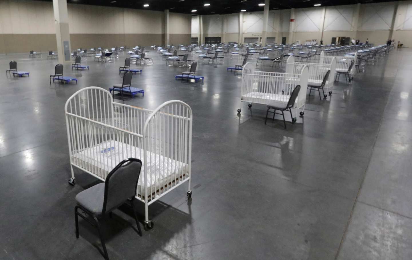 A row of empty cribs