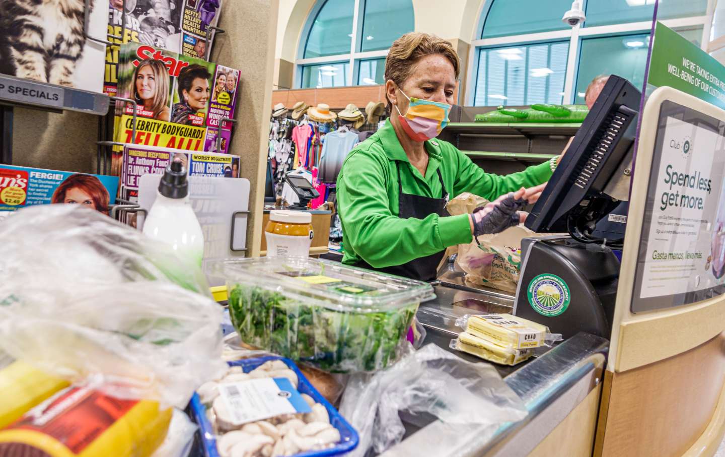 A person rings up groceries