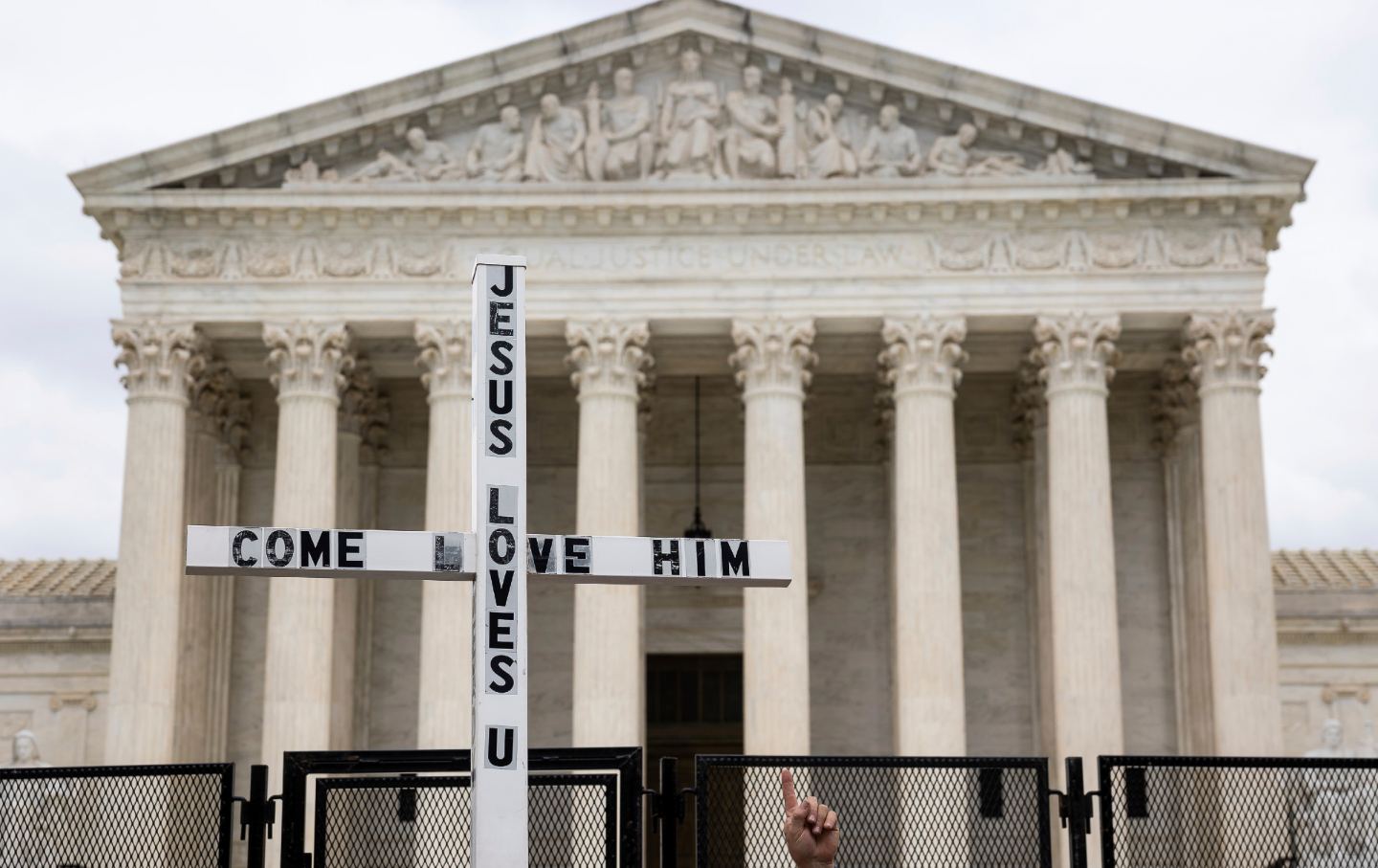 A cross held up in front of the Supreme Court