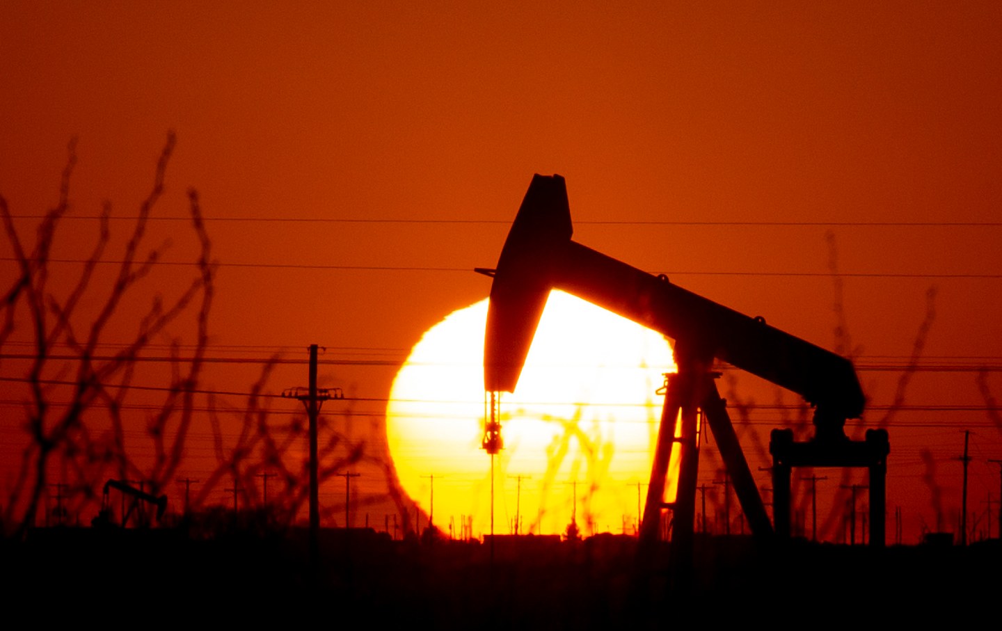 Oil pump jack with sunset