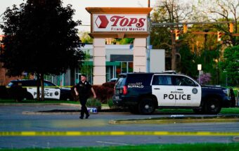 Police officer outside grocery store shooting site in Buffalo