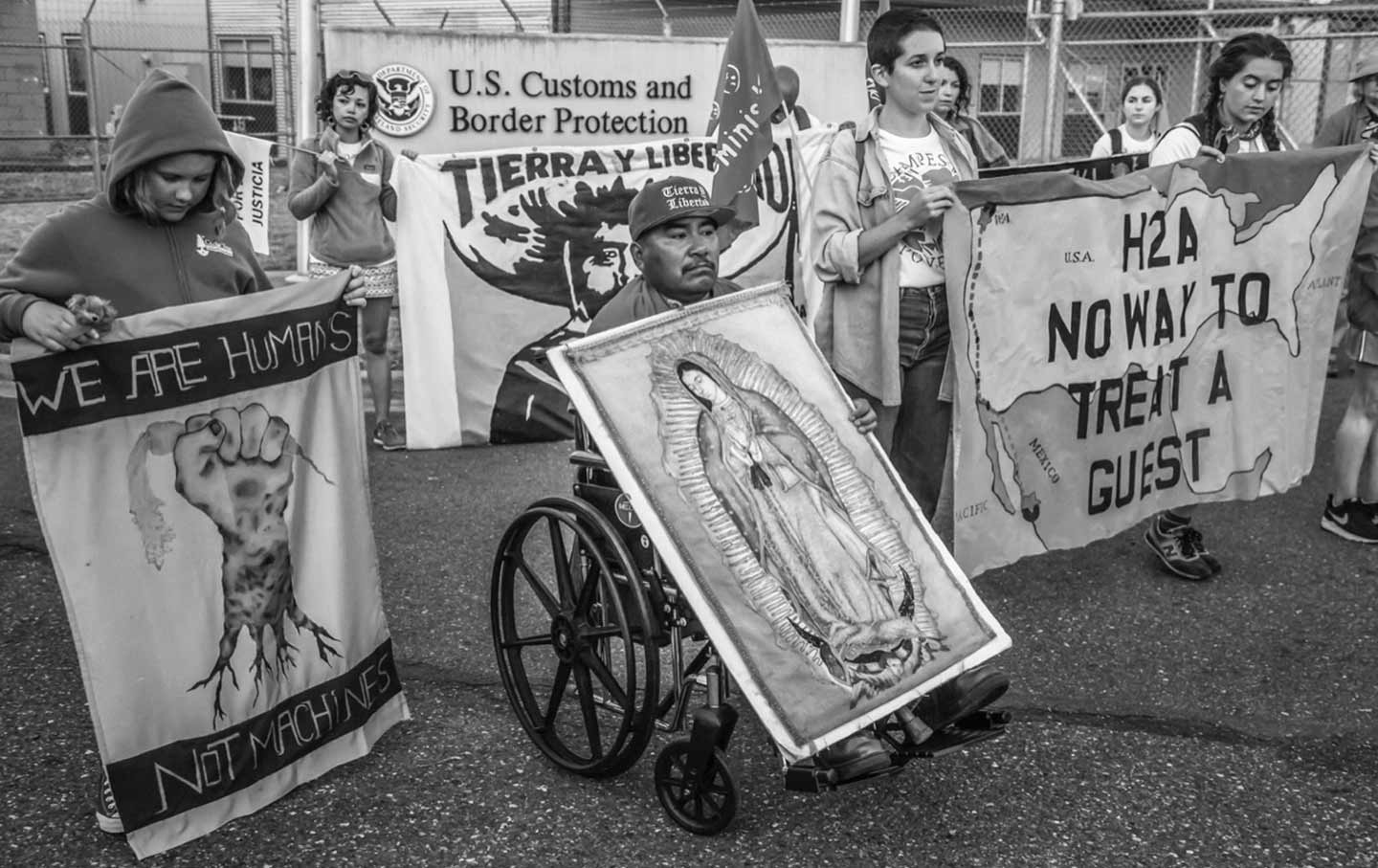 Farm workers mmarch to protest the H2-A guestworker program