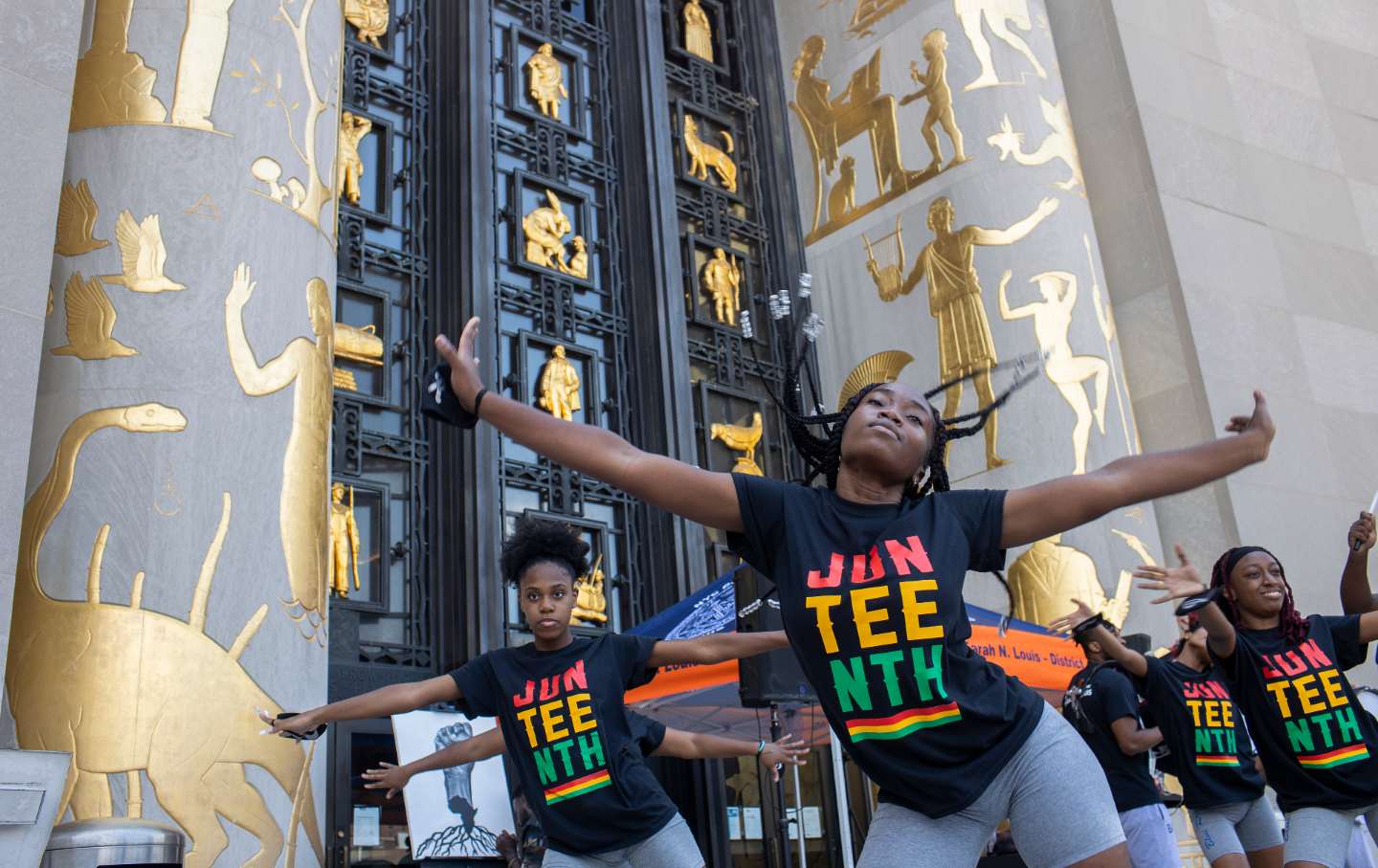 Girls dance outside the Brooklyn Library.