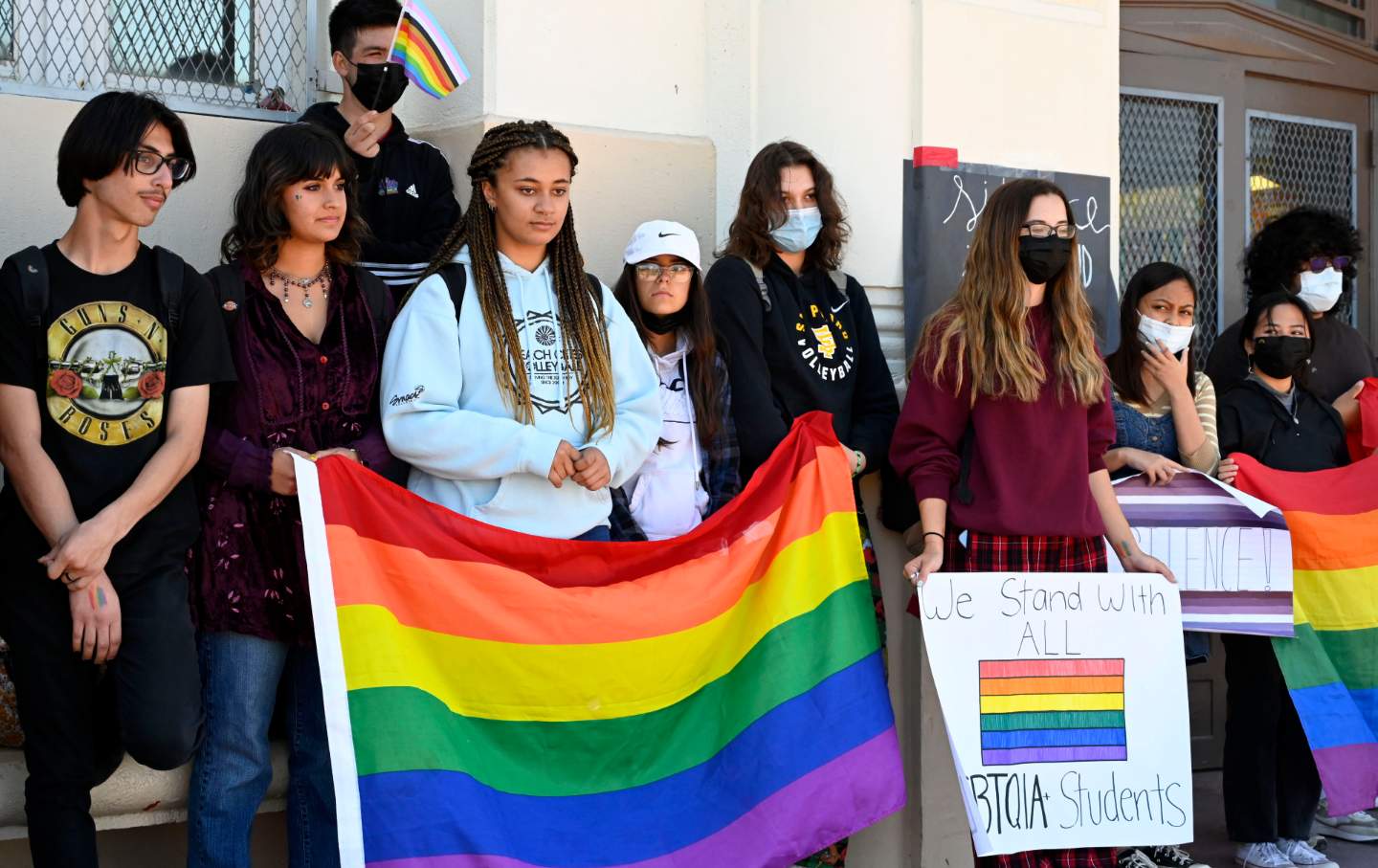 Students stand with pride flags