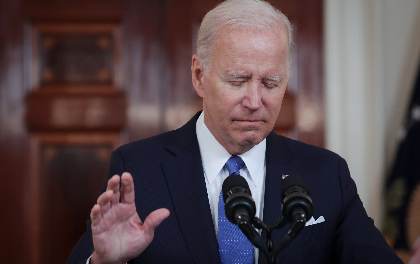 Joe Biden holds up his hand and closes his eyes while addressing the Supreme Court’s decision on Dobbs in Washington D.C.