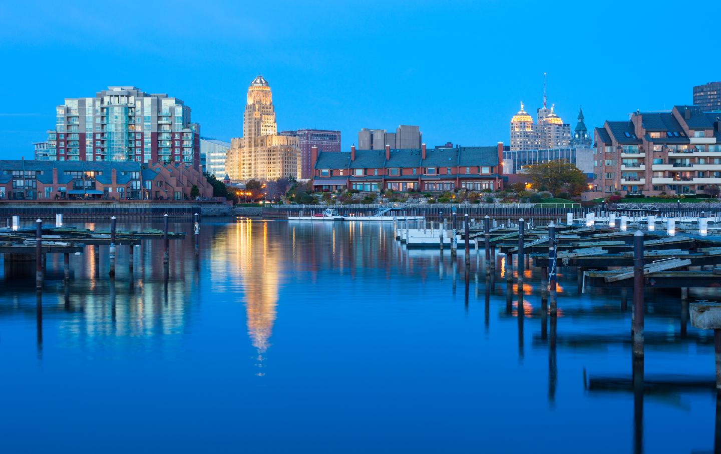 View of downtown Buffalo with City Hall reflecting in Lake Erie