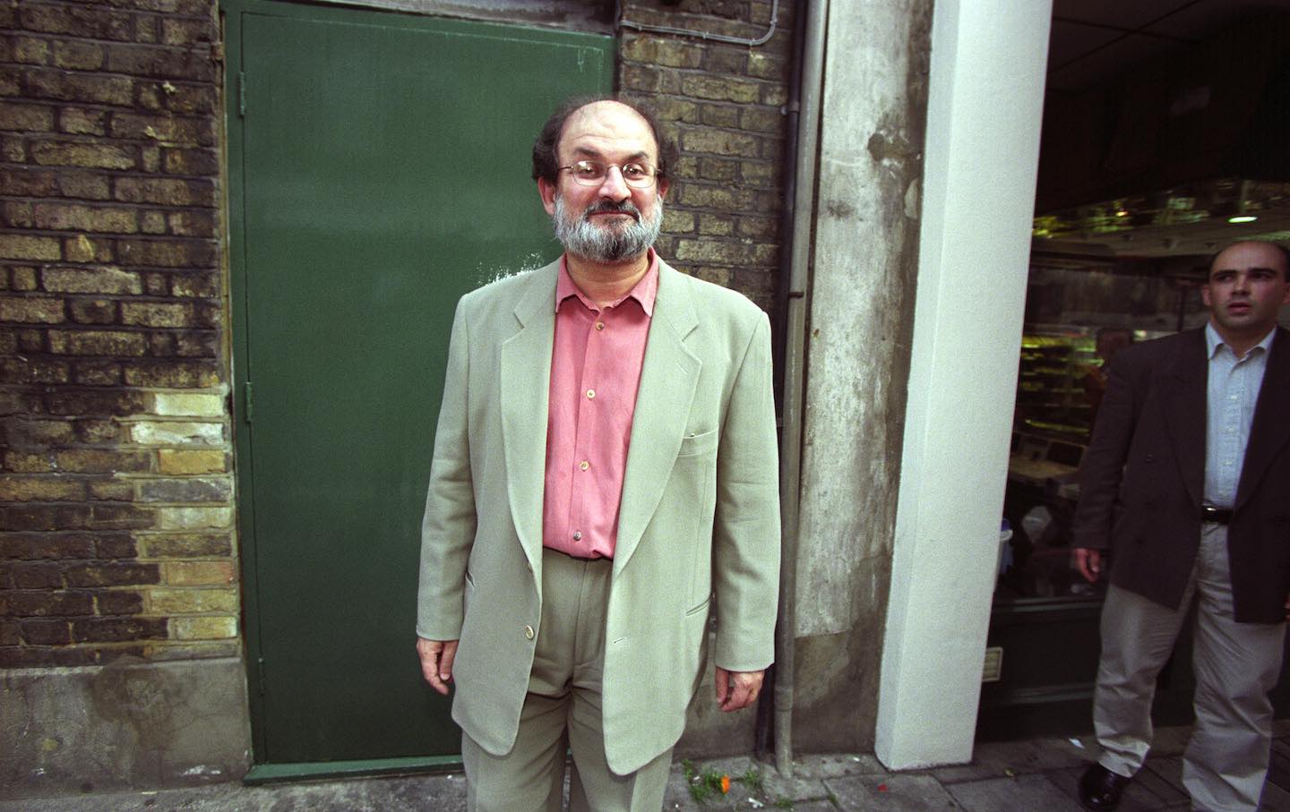 Salman Rushdie walks free before a media conference in Islington, North London, in 1998
