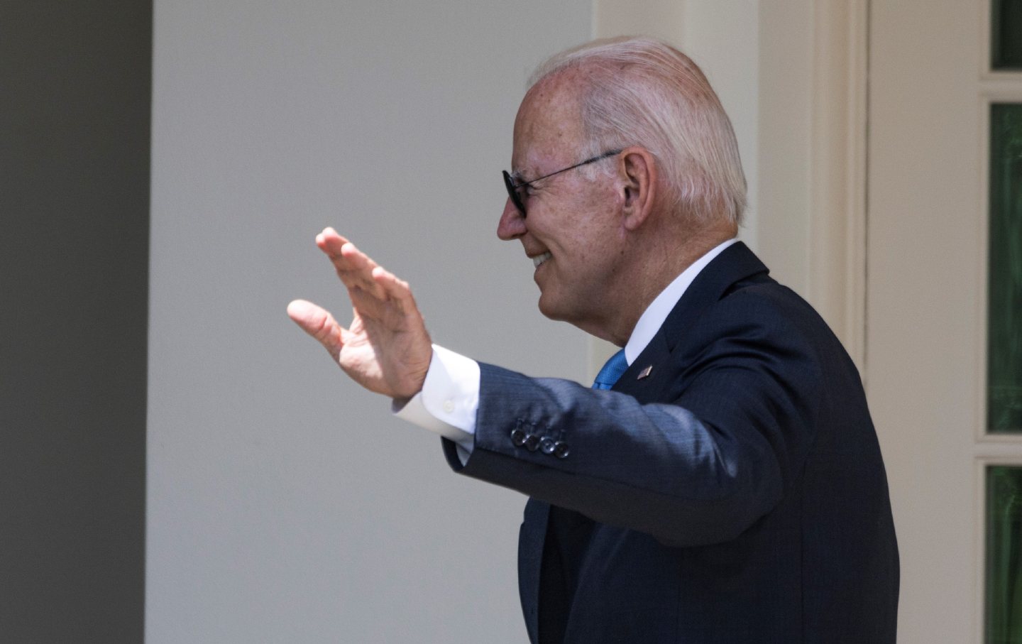 In July, President Biden appears and smiles at the White House after testing negative for Covid-19