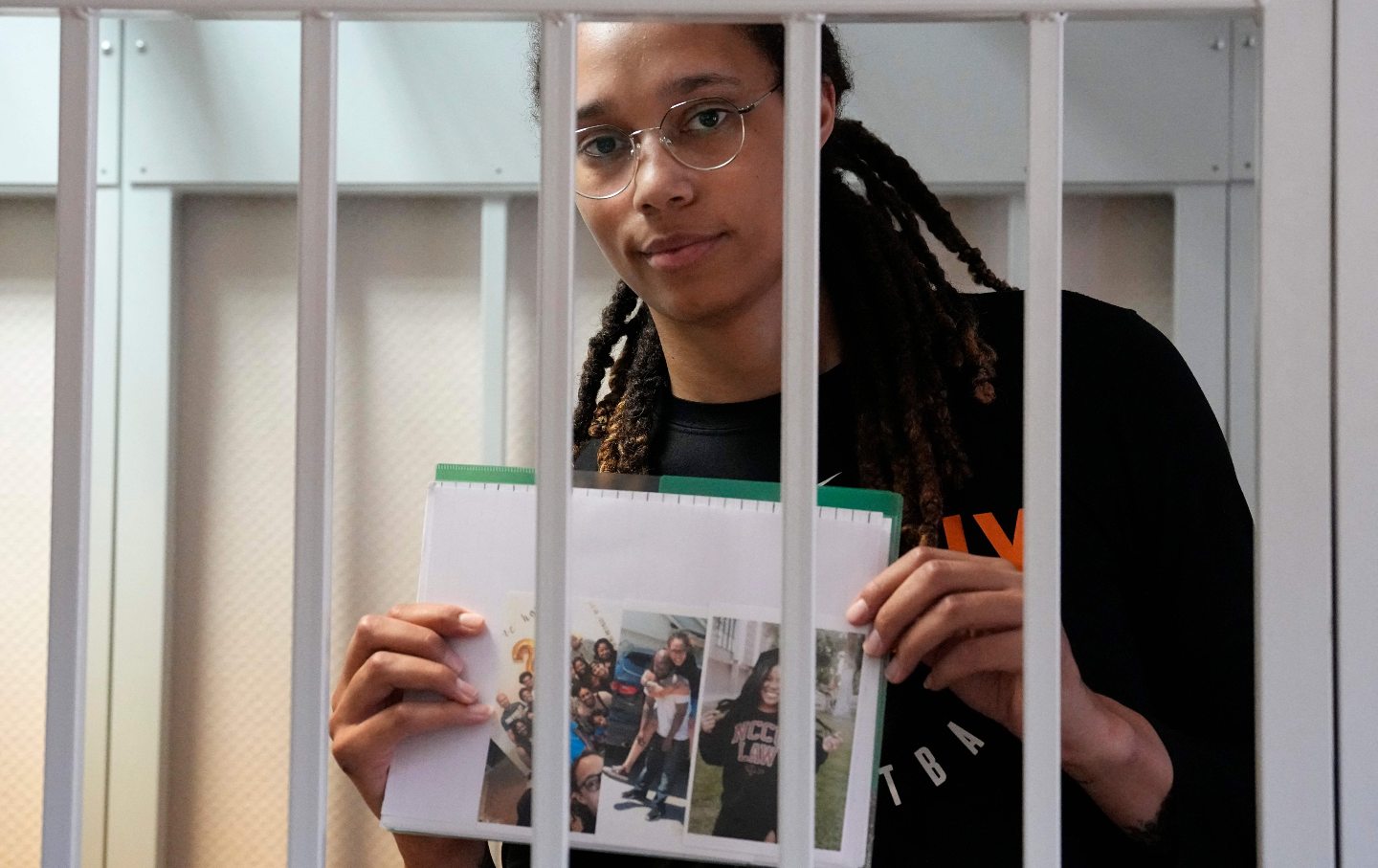 Brittney Griner holds a photo of her family behind bars
