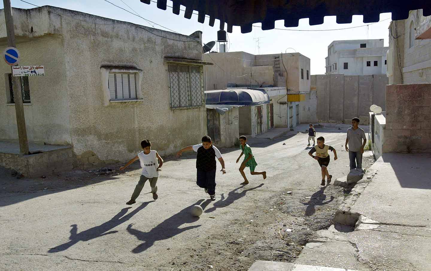 Palestinian boys play soccer