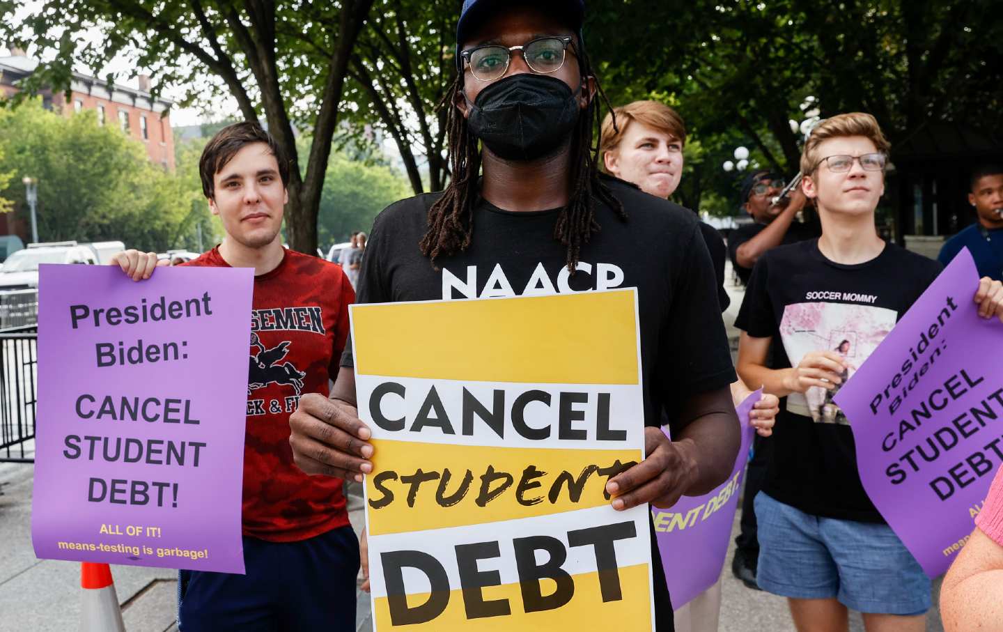 Demonstrators demand President Biden cancel student loan debt outside the White House.