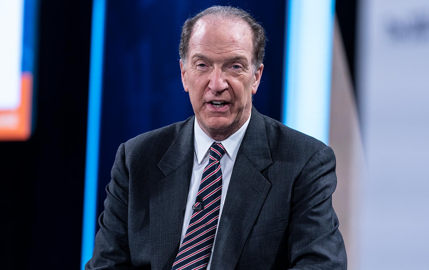 David Malpass speaking in a suit