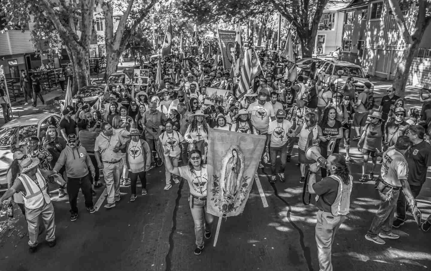 United Farm Workers members and supporters march to the capitol building in Sacramento