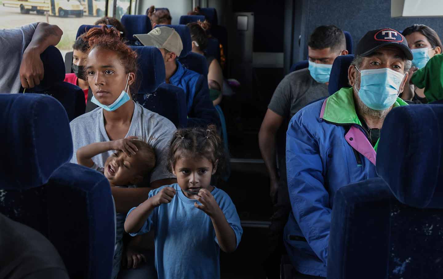 Asylum seekers on a bus