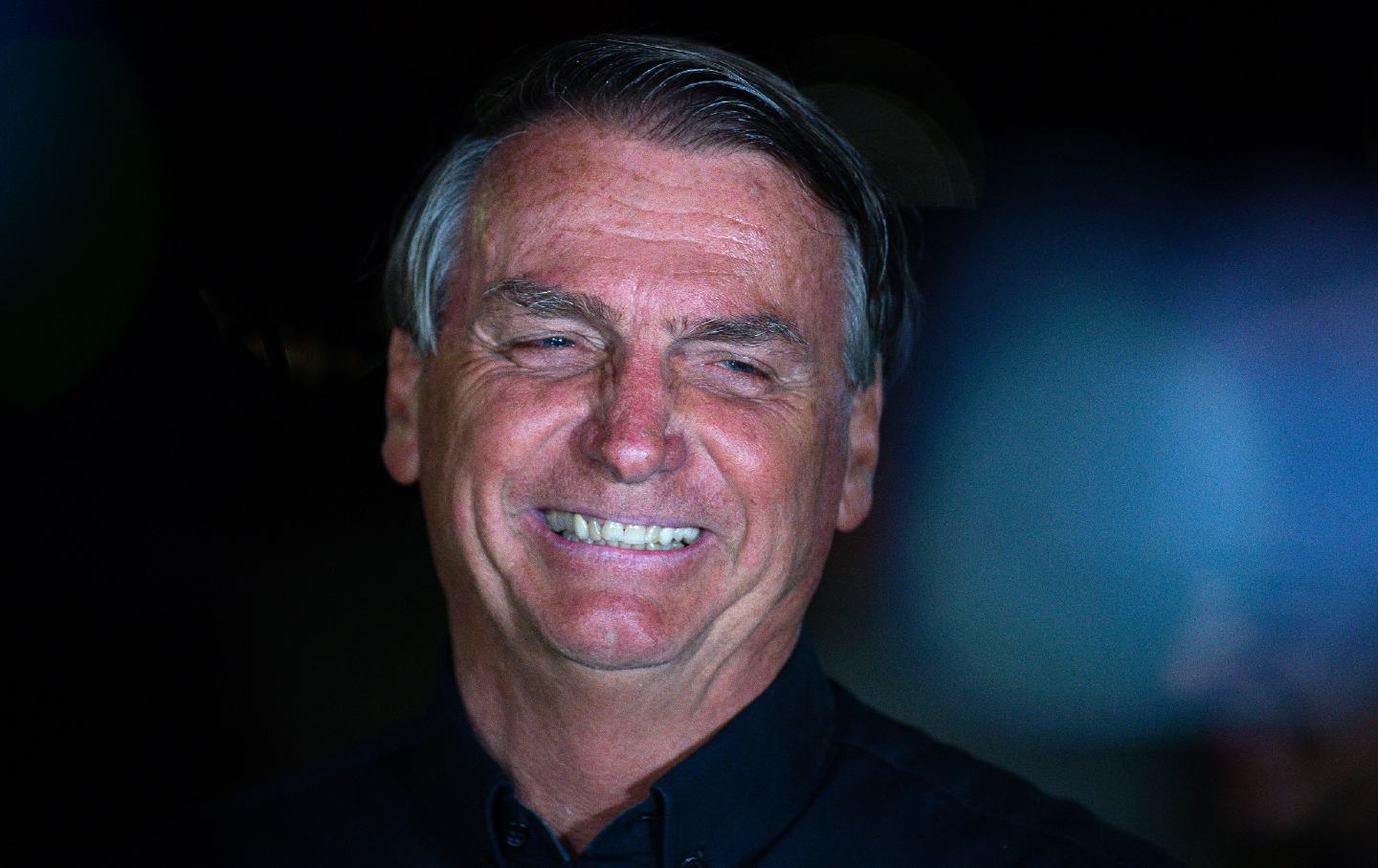 Brazilian President Jair Bolsonaro smiling.