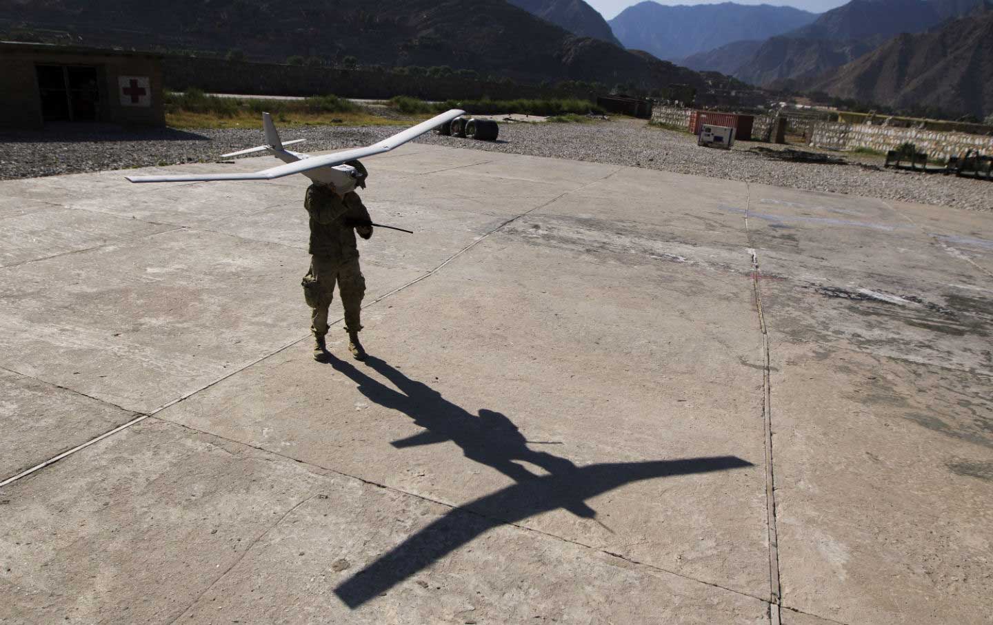 A soldier prepares to launch a drone in Afghanistan.