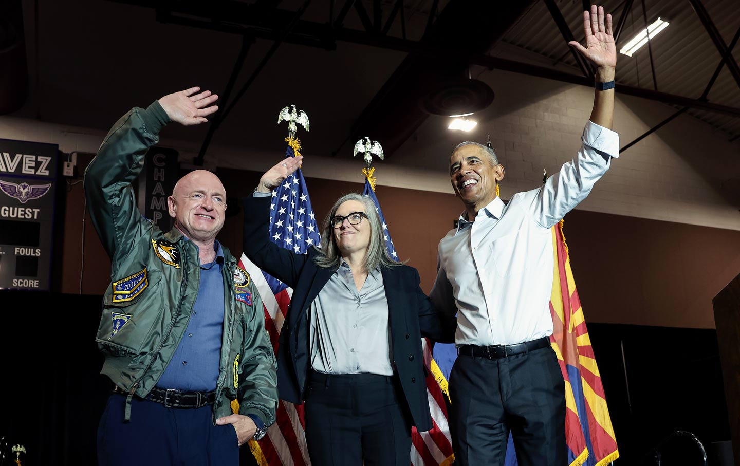 Mark Kelly, Katie Hobbs, and Barack Obama on stage