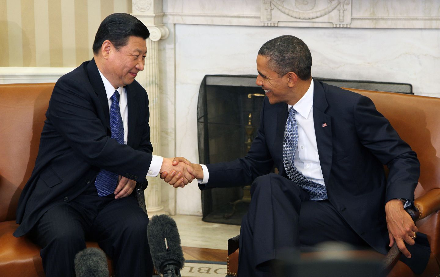 Barack Obama greets Xi Jinping