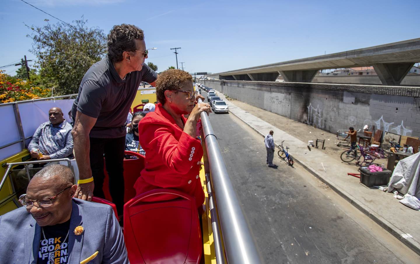 Karen Bass and former Mayor Antonio Villaraigosa look at a homeless encampment