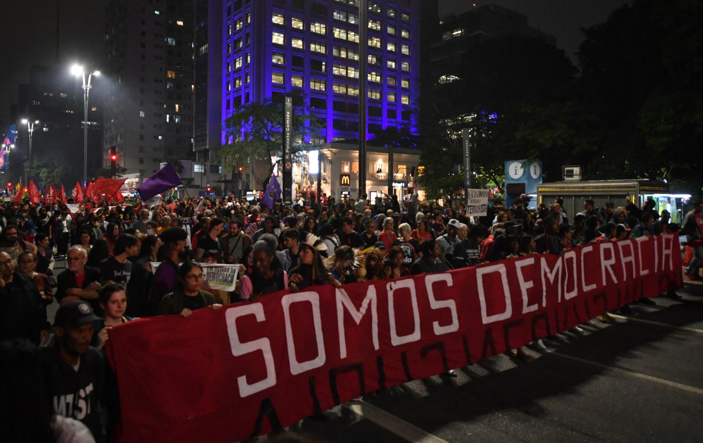 Pro-democracy demonstrators with a banner declaring 