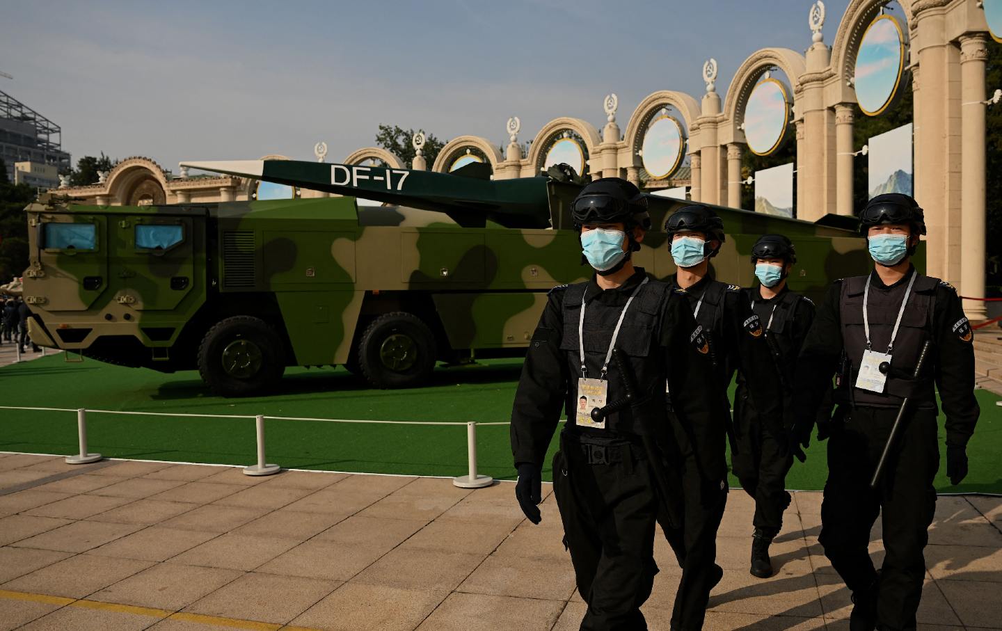 Chinese military march in front of missile