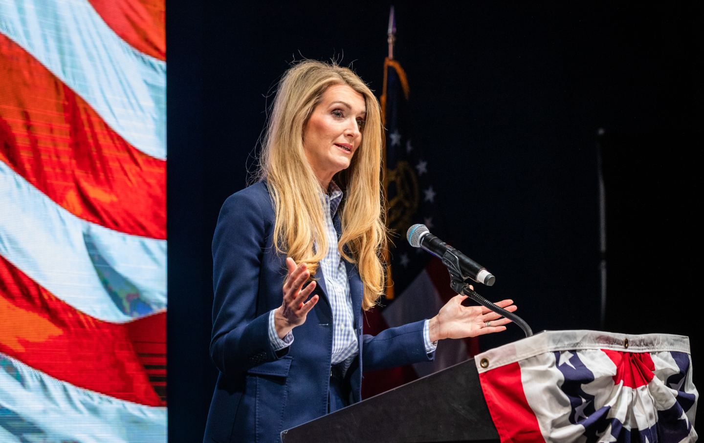 Kelly Loeffler on stage at a podium