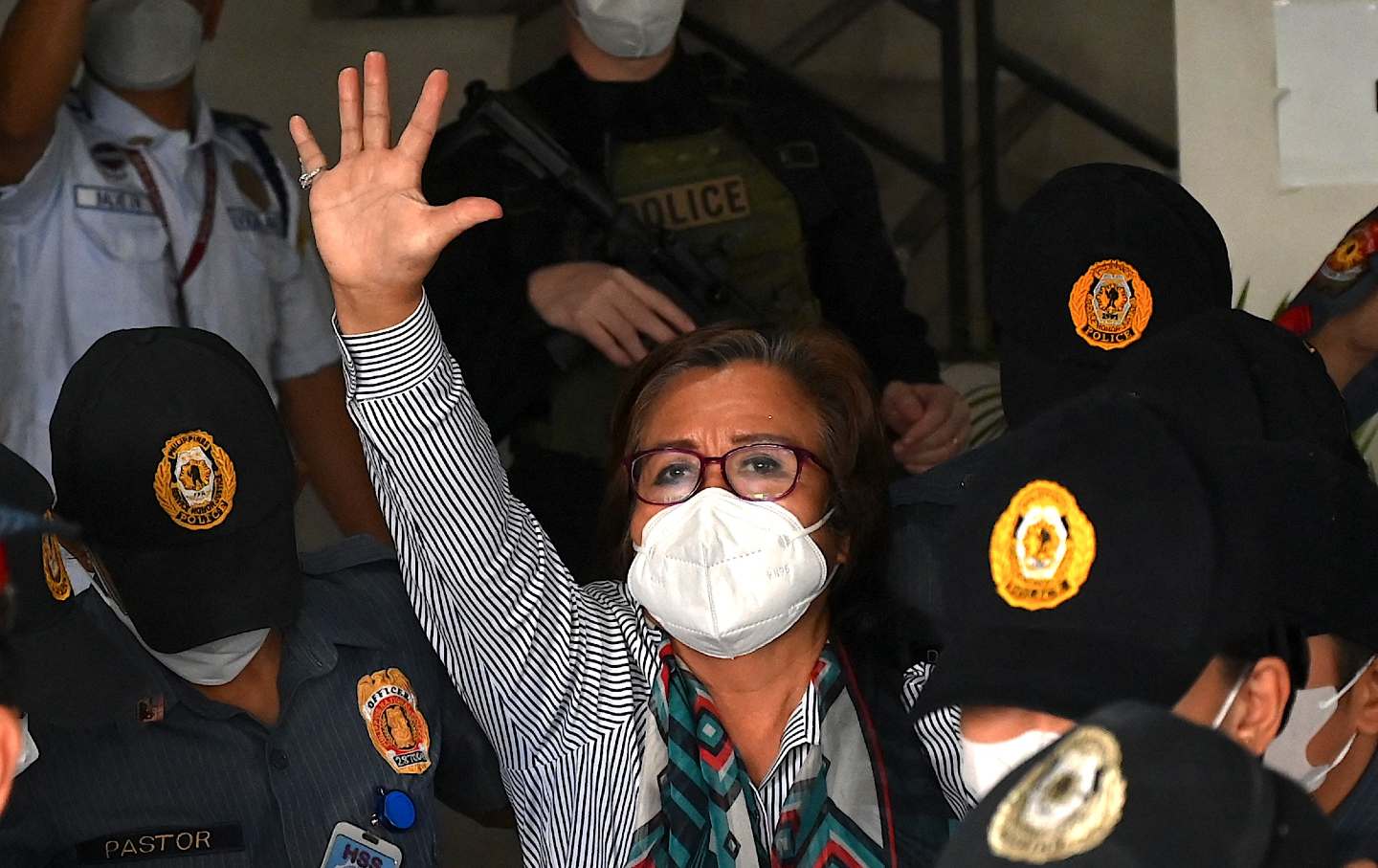 Filipina senator and human rights campaigner Leila de Lima waves after her hearing in Manila.