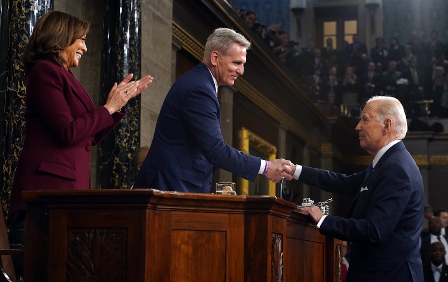 President Joe Biden shakes hands with House Speaker Kevin McCarthy