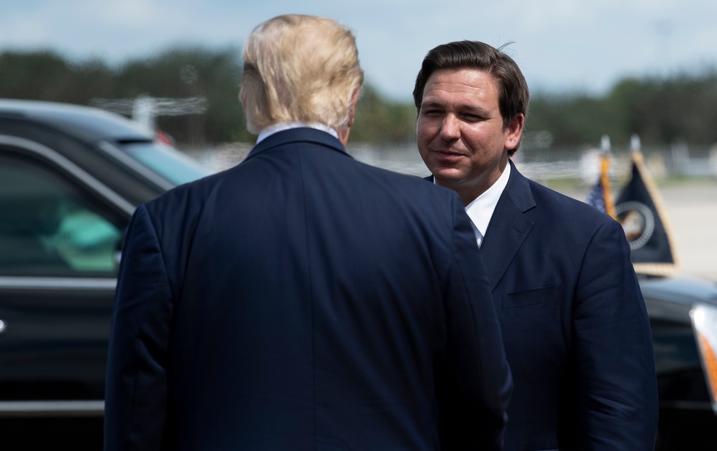 Donald Trump is greeted by Florida Governor Ron DeSantis