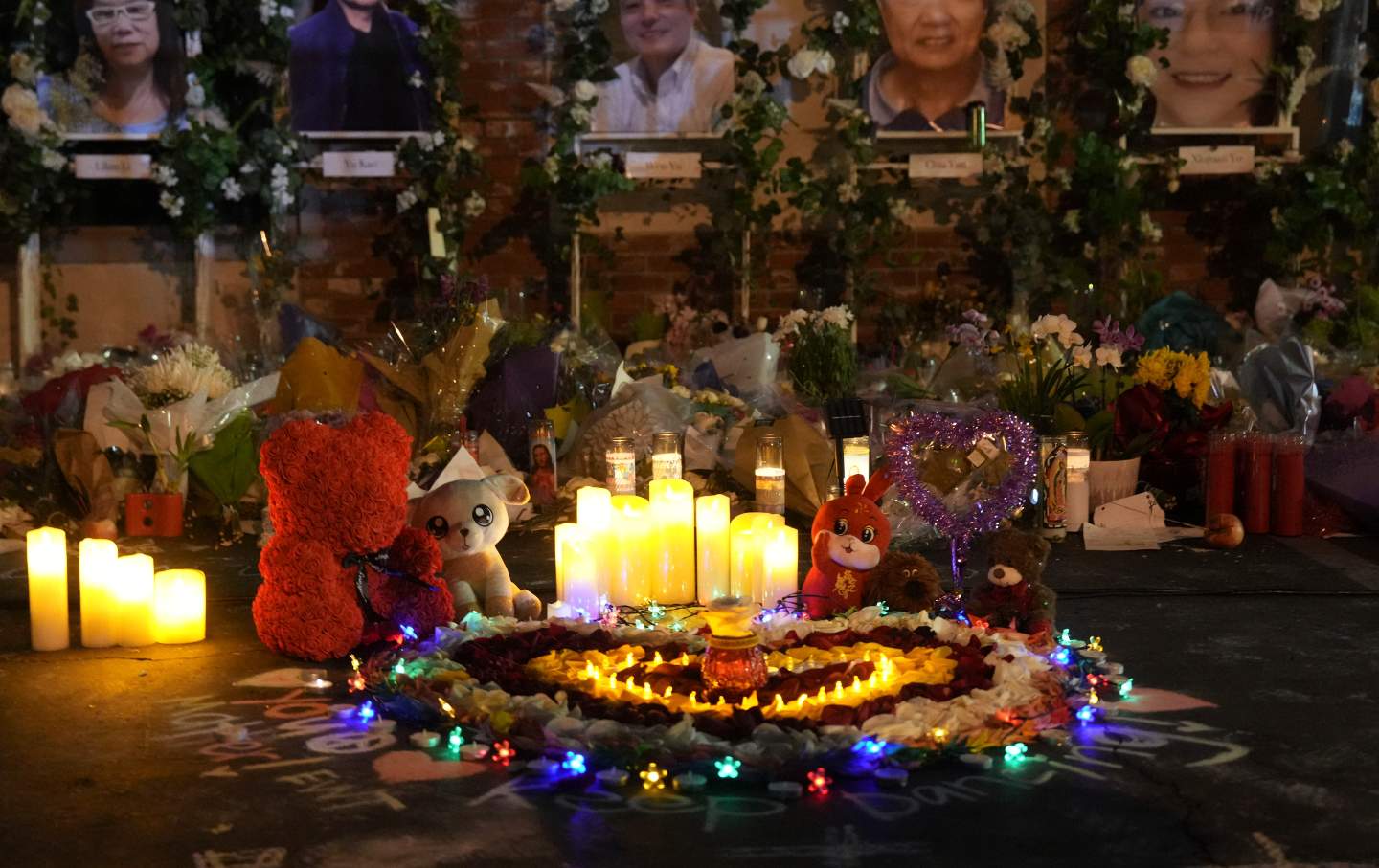 Flowers and candles at a memorial outside the Star Ballroom Dance Studio in Monterey Park, California.