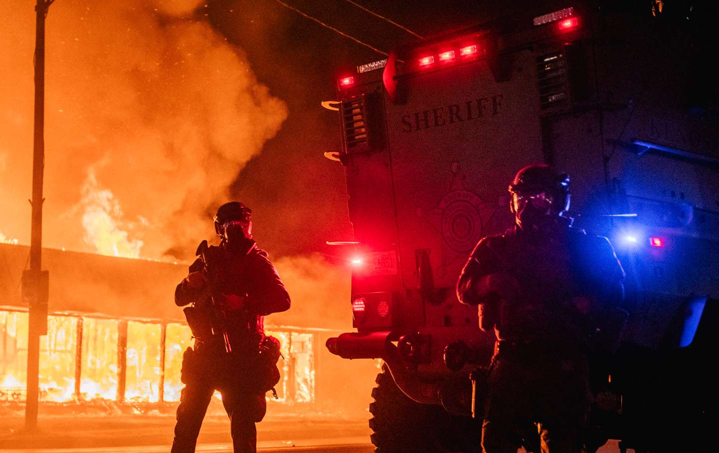 A police armored vehicle patrols an intersection on August 24, 2020 in Kenosha, Wisconsin.