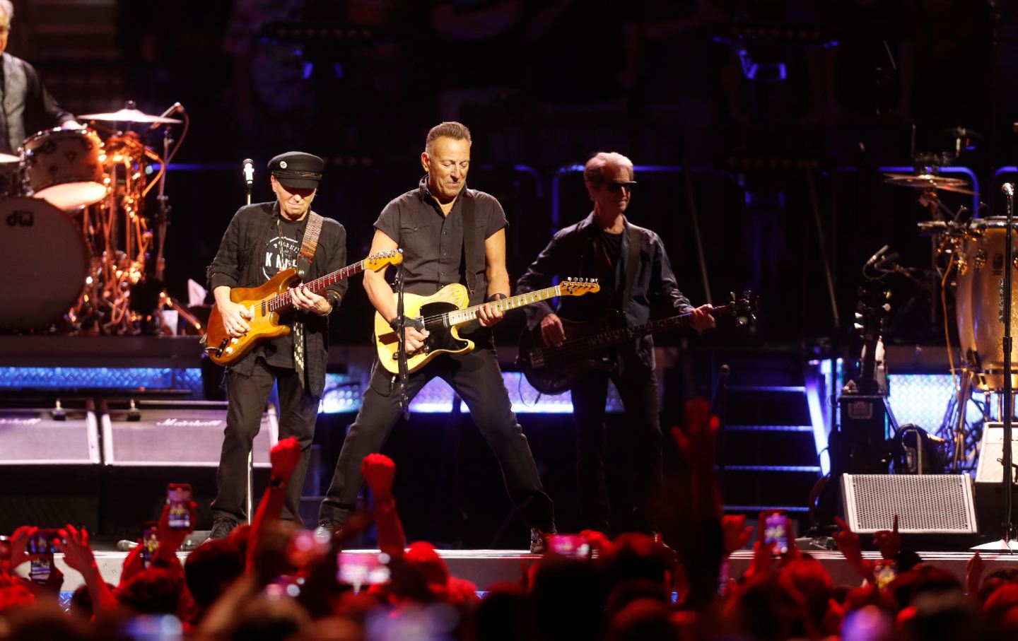 Nils Lofgren and Bruce Springsteen onstage.