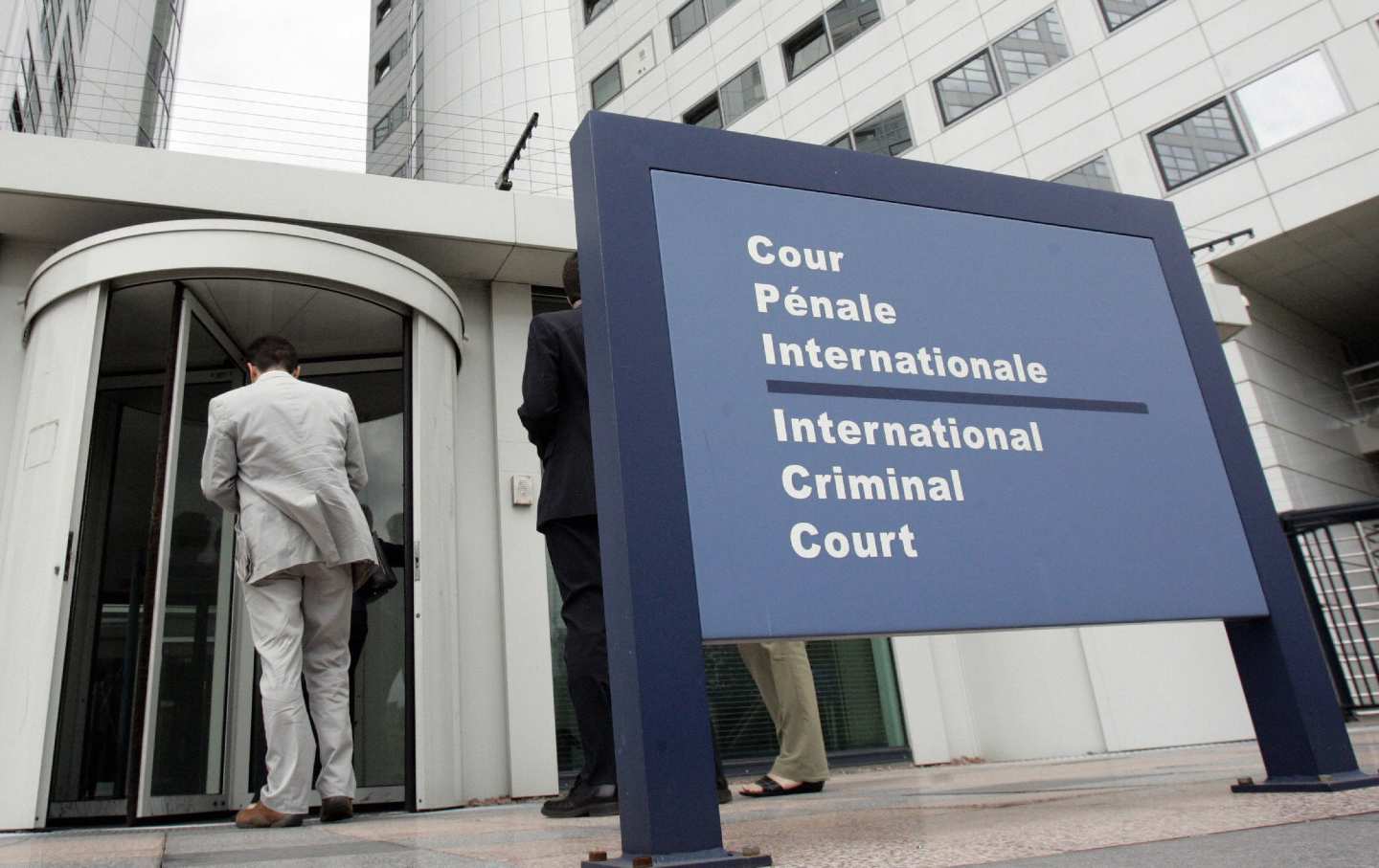 People enter the International Criminal Court at The Hague in the Netherlands.