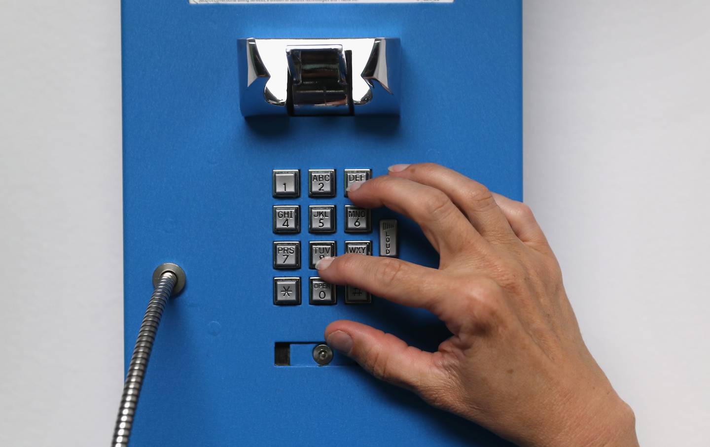 A prison inmate makes one of her daily allotment of six phone calls at the York Community Reintegration Center on May 24, 2016 in Niantic, Connecticut.