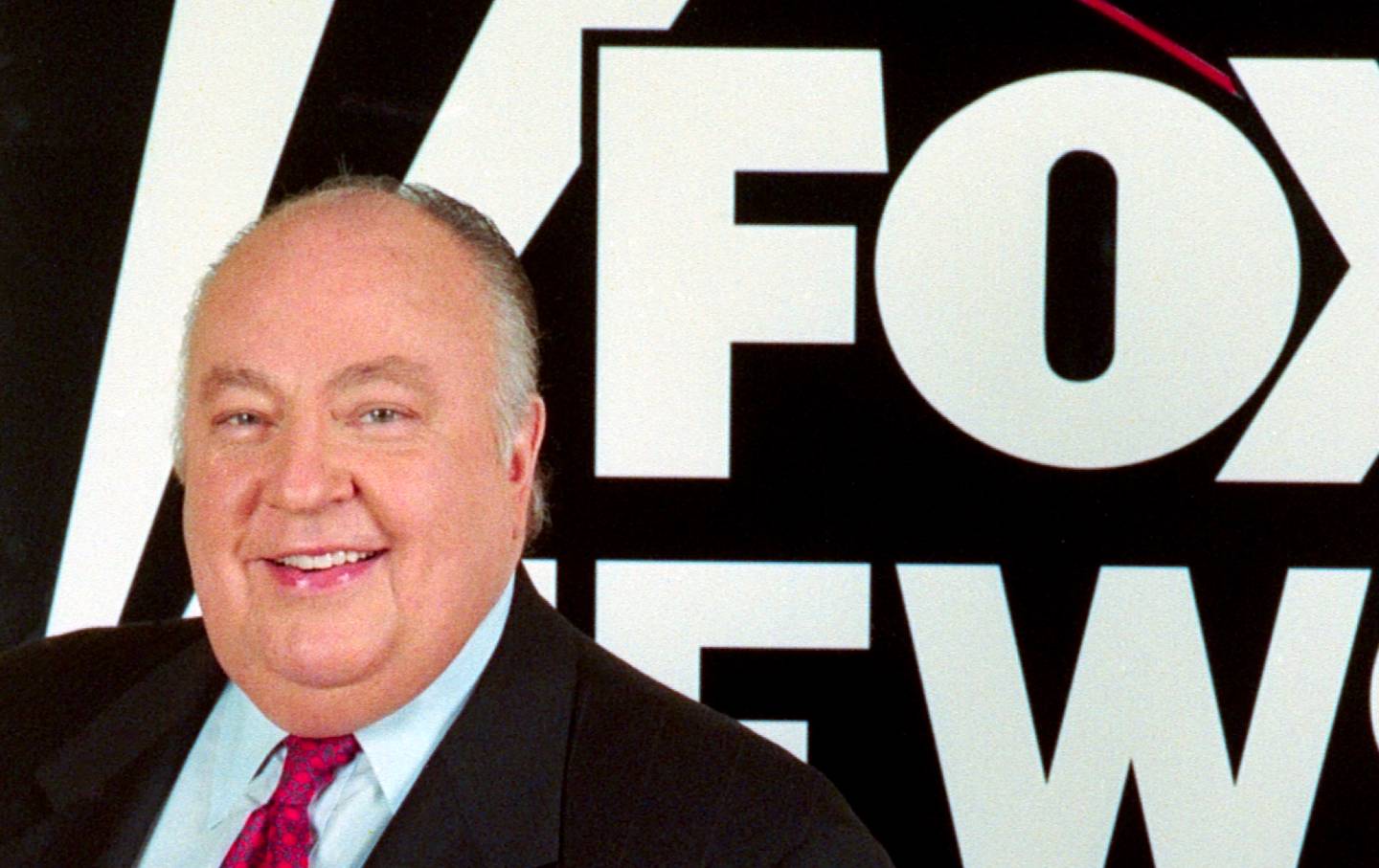 Television executive and Chairman of Fox News Roger Ailes in front of logo of recently launched Fox News Channel at Television Critics Association press event, January 14, 1997.