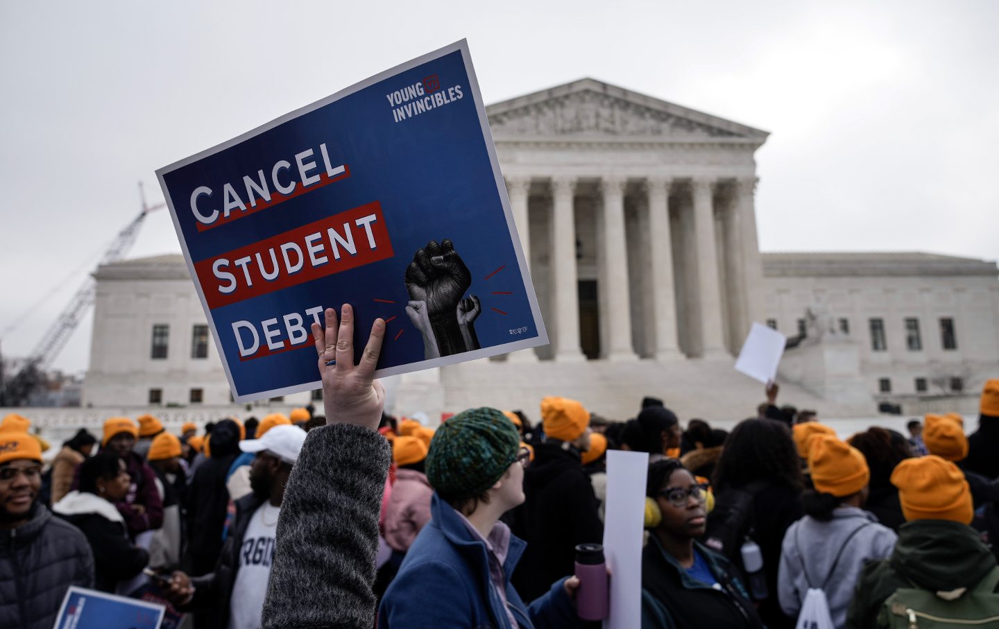 Protesters rally in support of the Biden administration's student debt relief plan