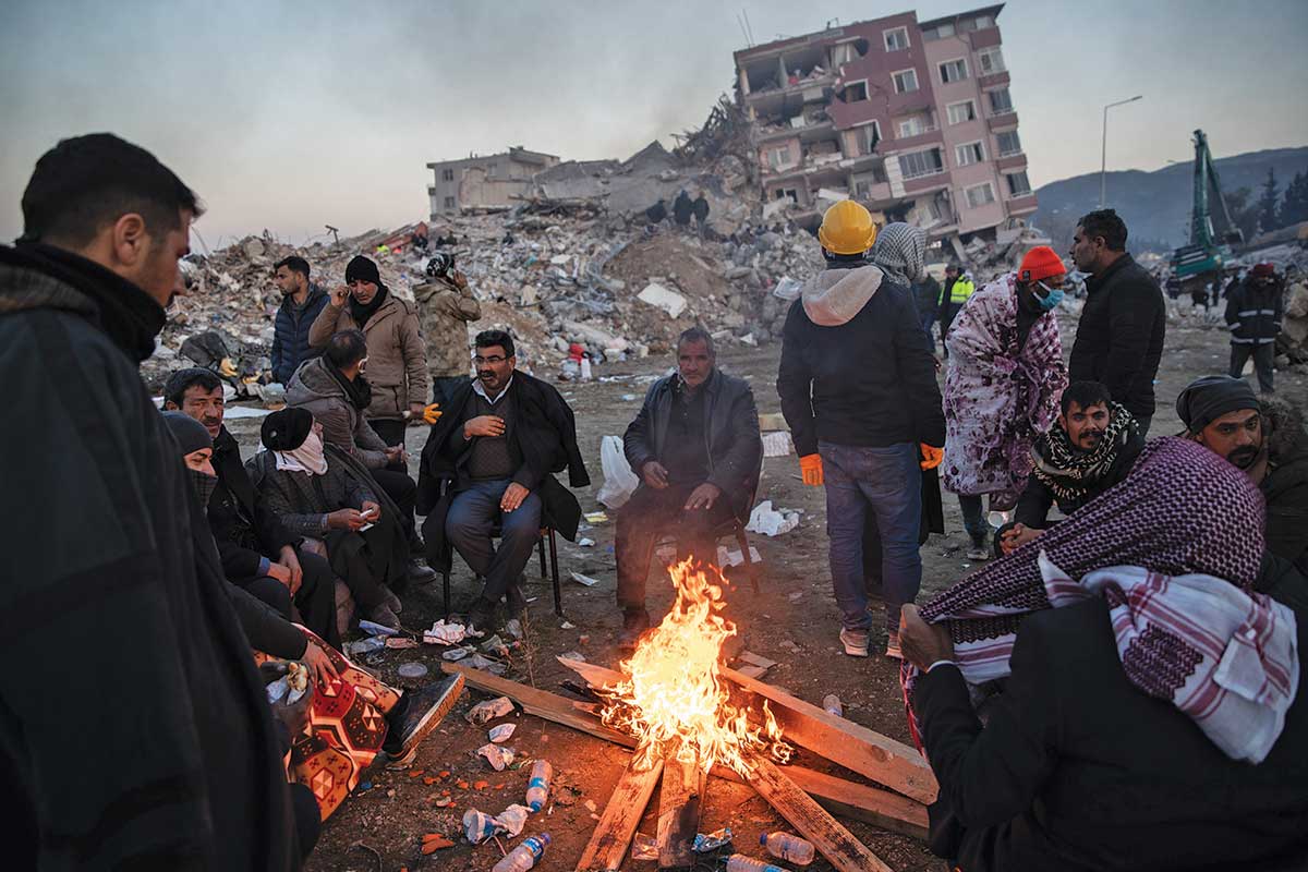 In a southern Turkish city, people wait for news of their loved ones, trapped benath the rubble