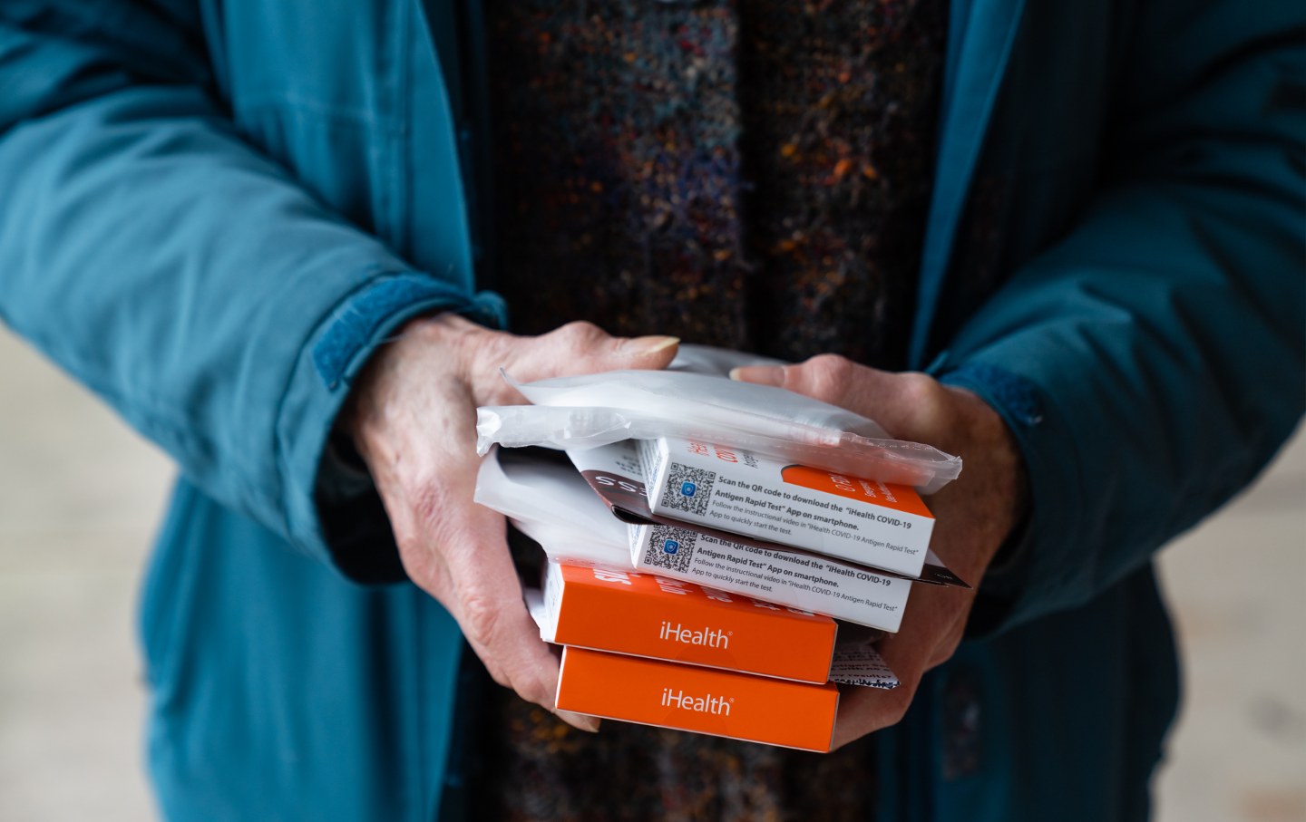 Helen Schietinger, 74, holds her allotted masks and Covid-19 self-test kits