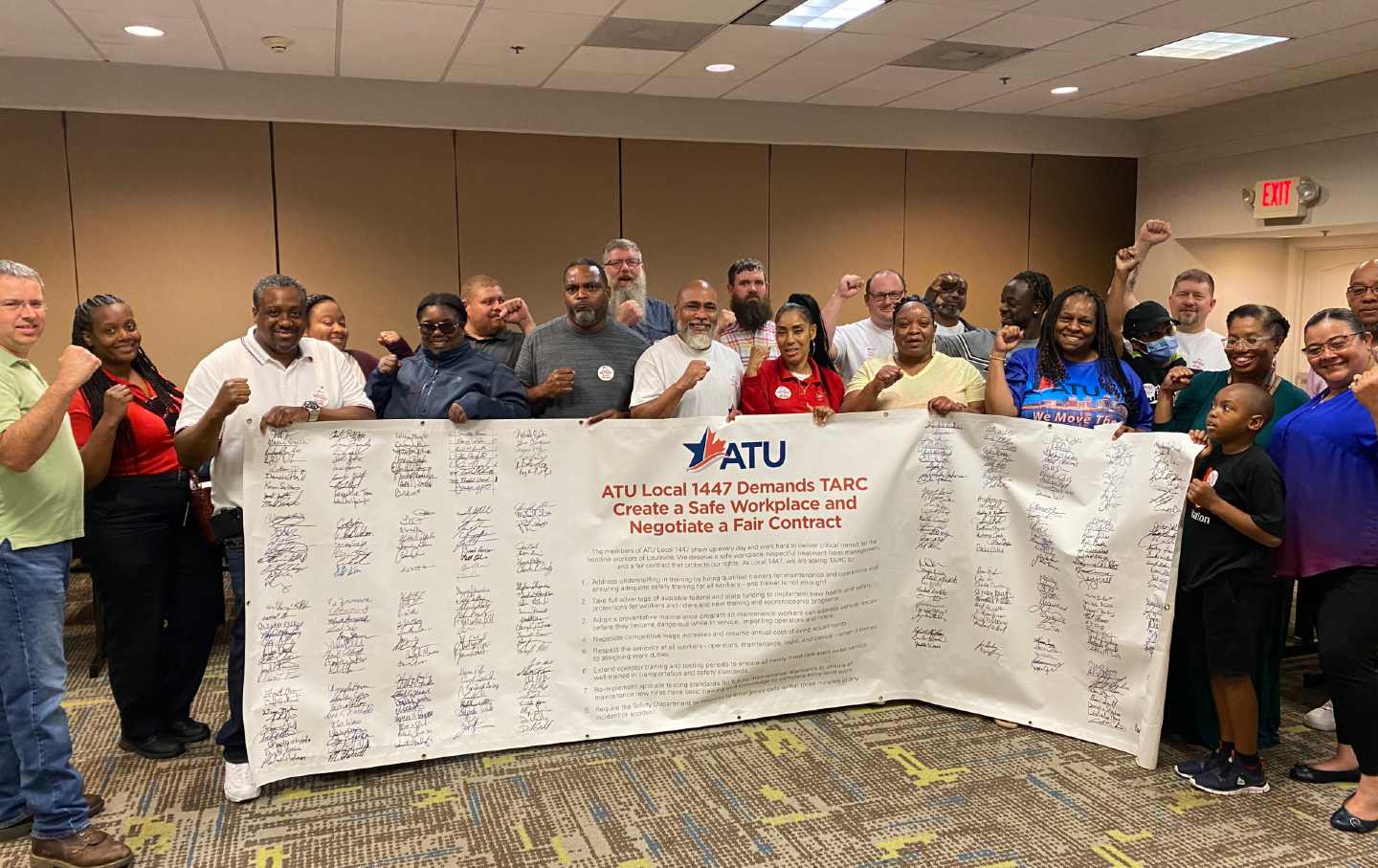 Triumphant ATU members with their signed petition