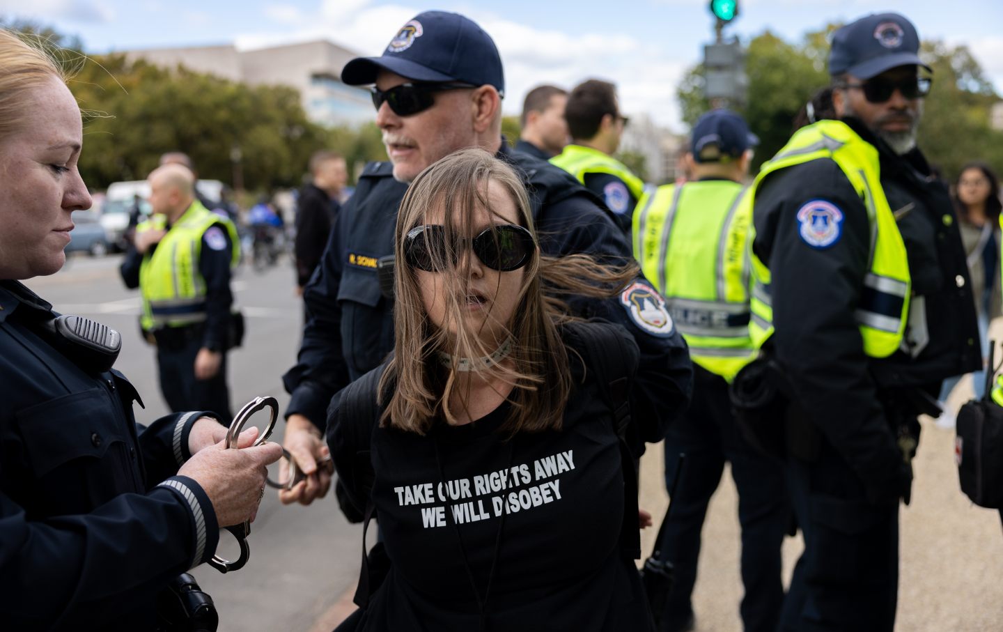 A woman wearing a shirt saying 